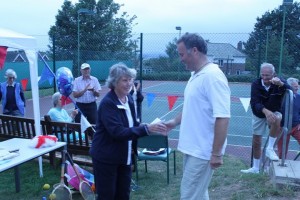 Jackie presents the winning prize to Barrie Bissett