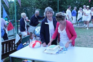 Jill and Jackie preparing to cut the cake.